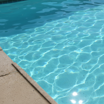 Yellow tennis balls floating on blue swimming pool water