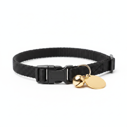 Side view of black cat collar showing breakaway buckle and gold bell