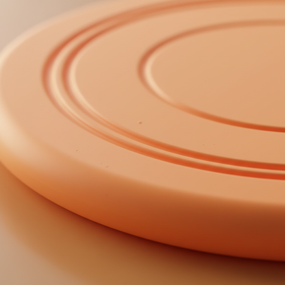 Close-up detail of ribbed non-slip texture on rubber dog frisbee